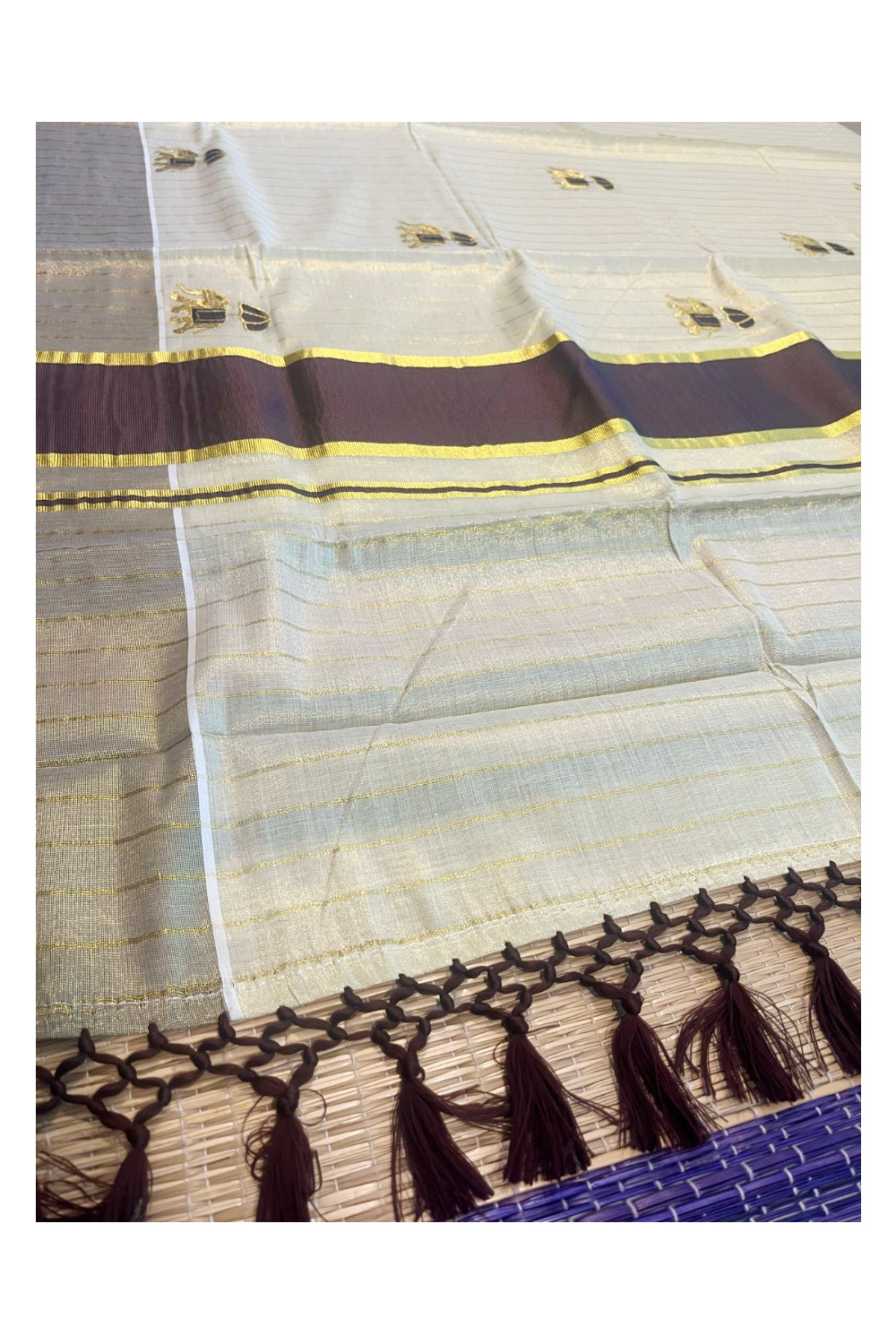 Kerala Tissue Kasavu Lines Saree with Golden And Brown Elephant Embroidery Works