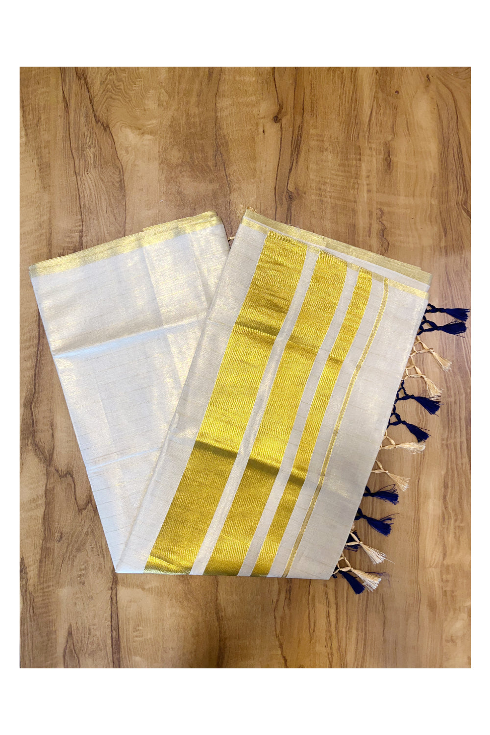 Kerala Tissue Lines Kasavu Saree with Blue Tassels Work