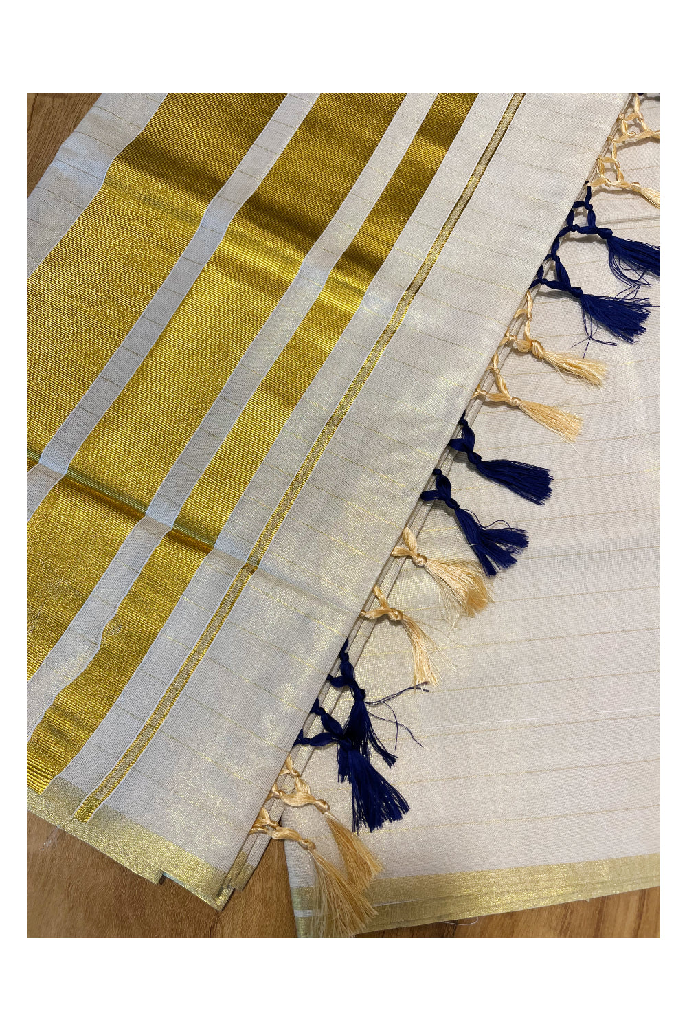 Kerala Tissue Lines Kasavu Saree with Blue Tassels Work