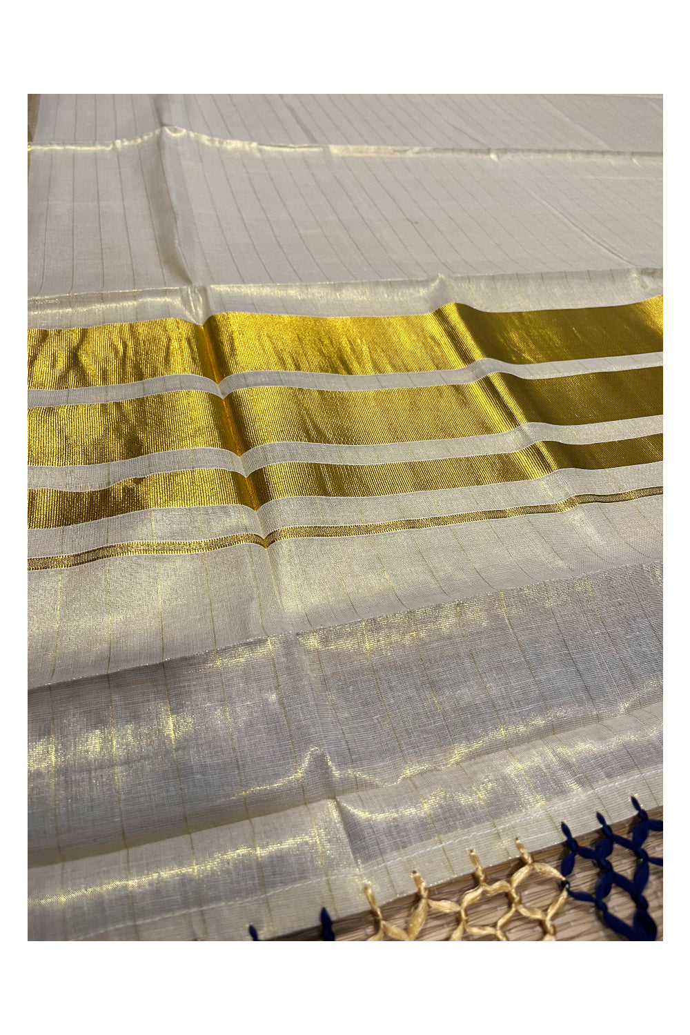 Kerala Tissue Lines Kasavu Saree with Blue Tassels Work