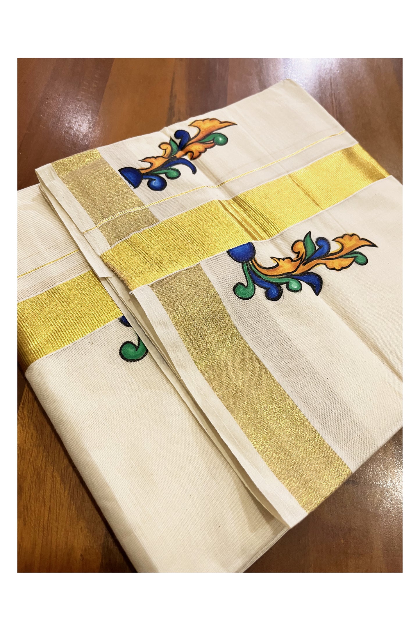 Off White Kerala Cotton Double Mundu with Hand Painted Designs on Kasavu Border