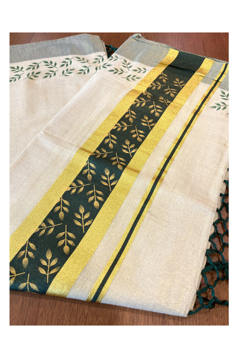 Kerala Tissue Kasavu Saree with Golden and Green Block Prints on Border and Tassels Works