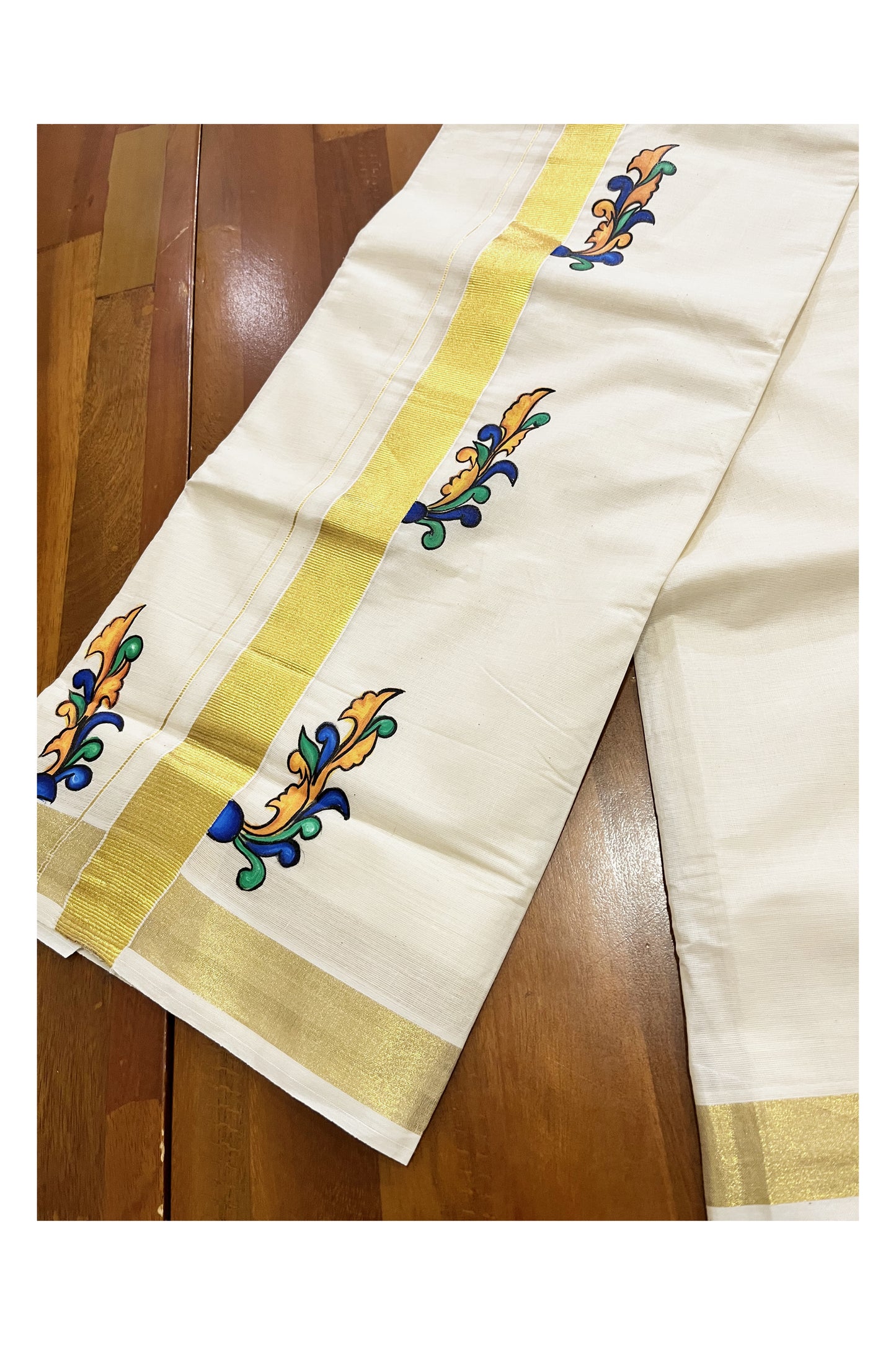 Off White Kerala Cotton Double Mundu with Hand Painted Designs on Kasavu Border