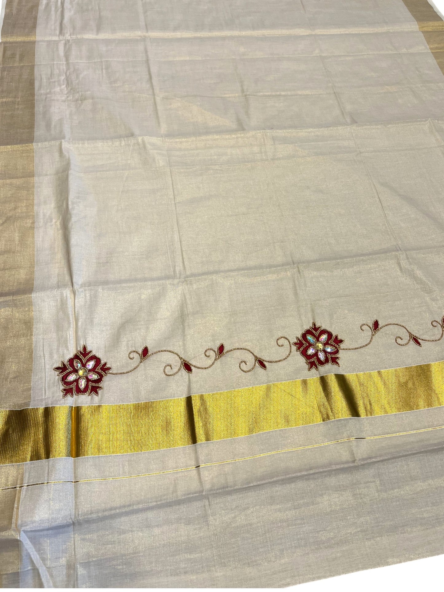 Kerala Tissue Kasavu Saree with Floral Embroidery and Sequins Work on Body