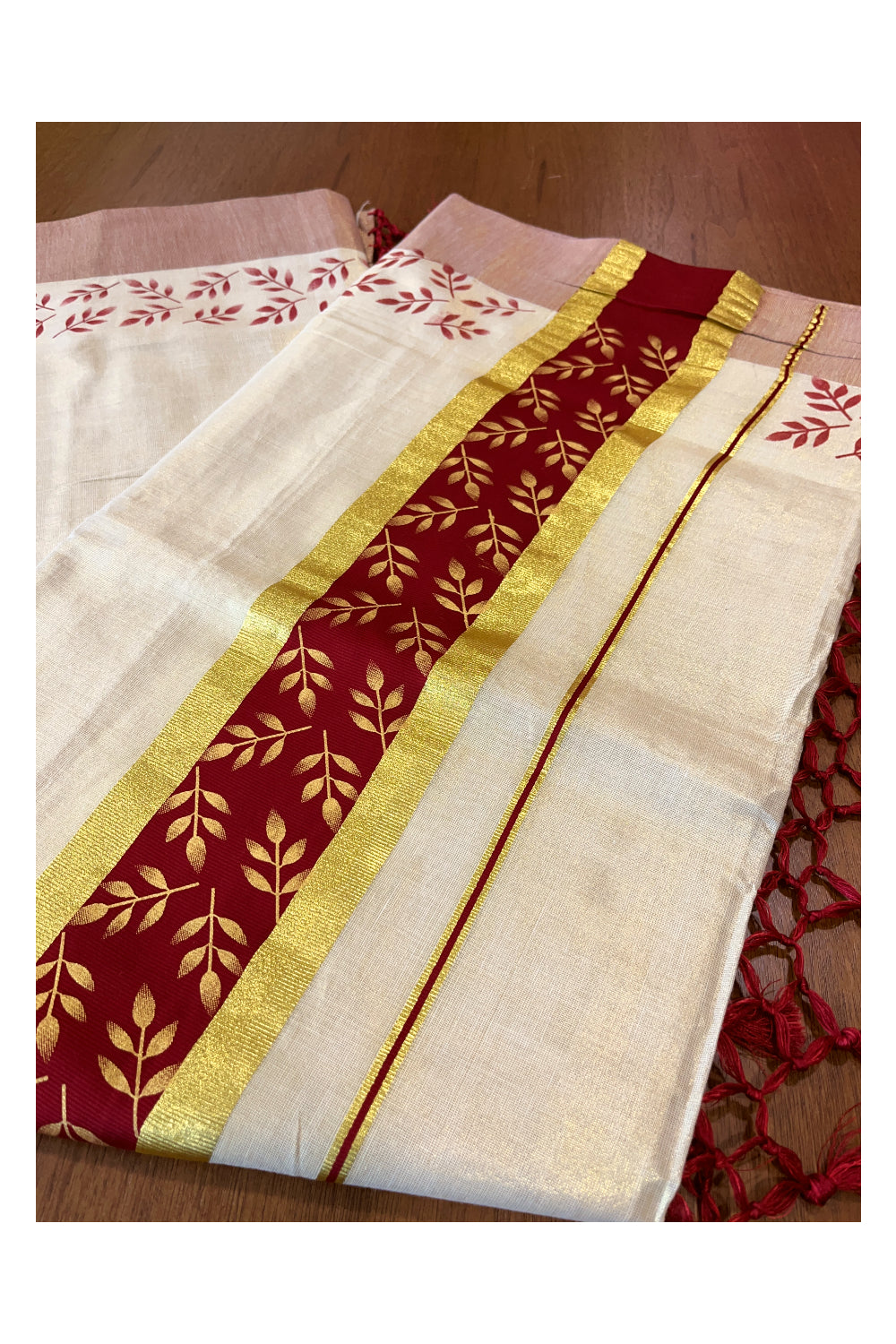 Kerala Tissue Kasavu Saree with Golden and Maroon Block Prints on Border and Tassels Works