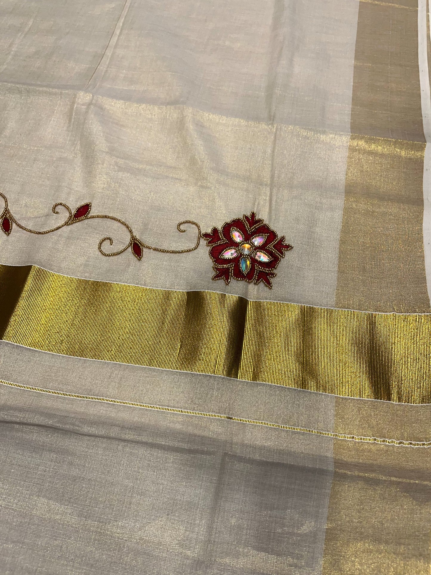 Kerala Tissue Kasavu Saree with Floral Embroidery and Sequins Work on Body