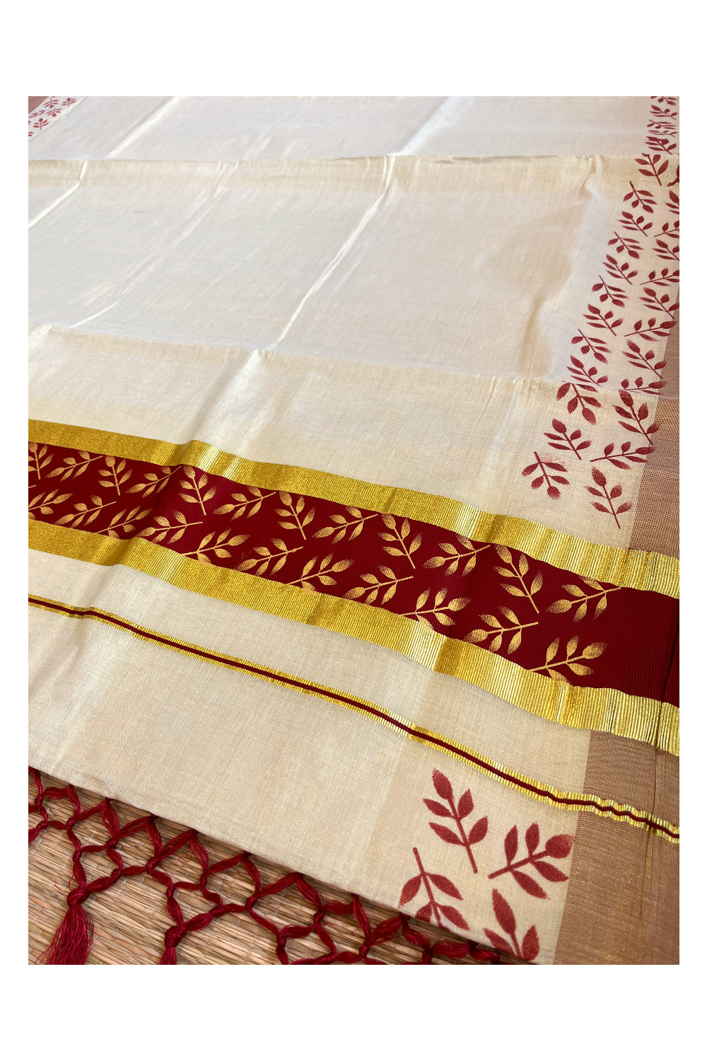 Kerala Tissue Kasavu Saree with Golden and Maroon Block Prints on Border and Tassels Works