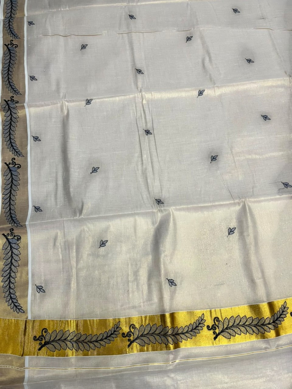Southloom Tissue Kerala Kasavu Saree with Floral Embroidery Design On Border