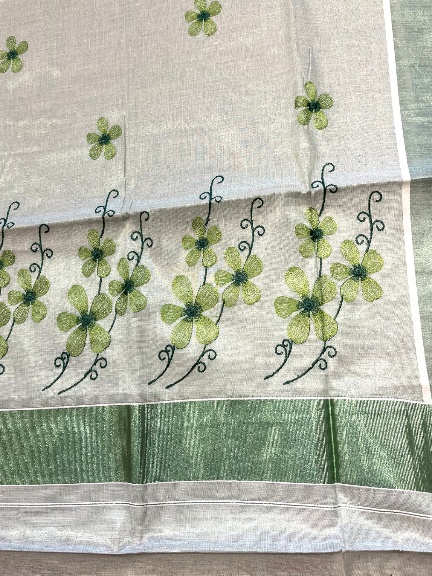Southloom Kerala Tissue Kasavu Saree with Green Floral Embroidery on Body and Border