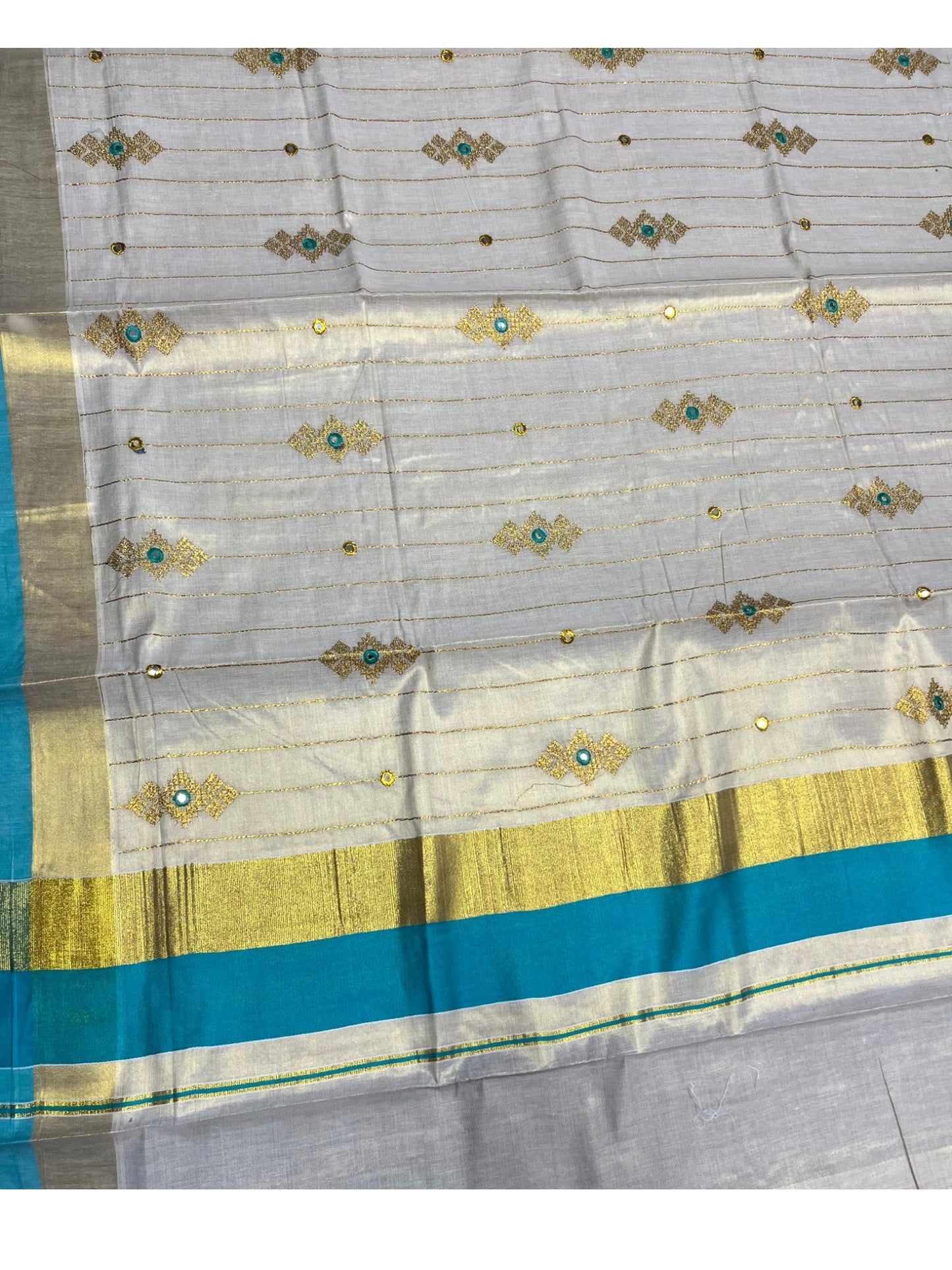 Southloom Kerala Tissue Kasavu Lines Saree with Golden And Turquoise Embroidery Works
