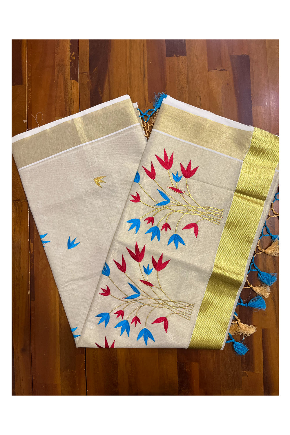 Kerala Tissue Kasavu Saree with Red and Blue floral Embroidery Saree