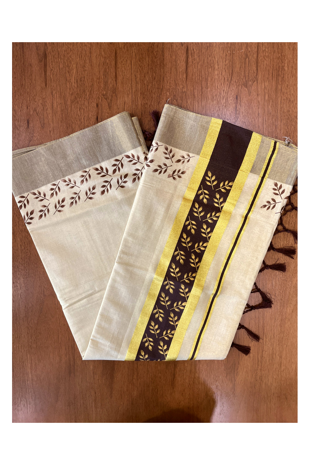 Kerala Tissue Kasavu Saree with Golden and Brown Block Prints on Border and Tassels Works