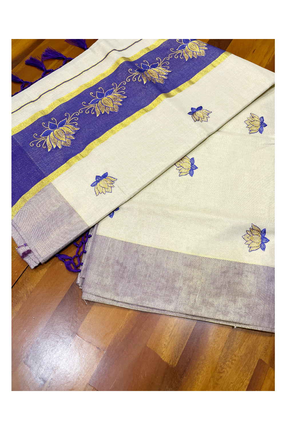 Southloom Kerala Tissue Kasavu Saree with Violet And Golden Lotus Embroidary Designs on Body