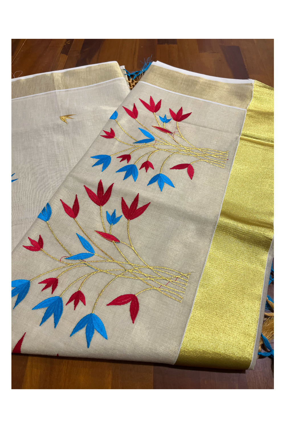 Kerala Tissue Kasavu Saree with Red and Blue floral Embroidery Saree