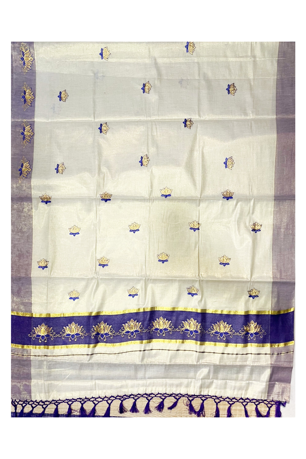 Southloom Kerala Tissue Kasavu Saree with Violet And Golden Lotus Embroidary Designs on Body