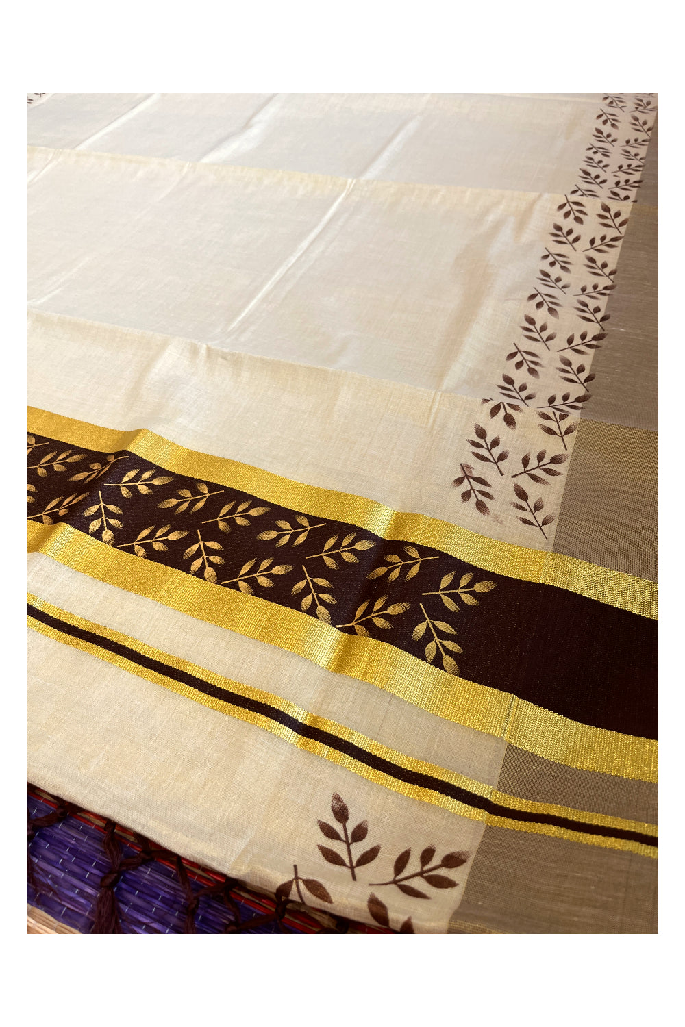 Kerala Tissue Kasavu Saree with Golden and Brown Block Prints on Border and Tassels Works