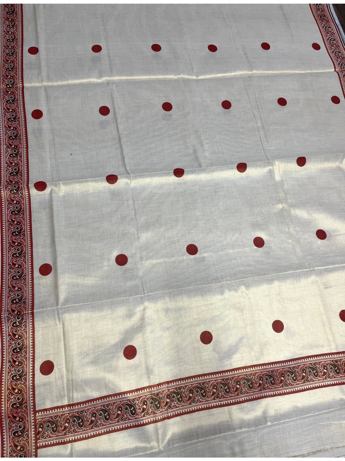 Southloom Kerala Tissue Plain Saree With Orange Polk Dots on Body and Floral Digital Prints in Borders