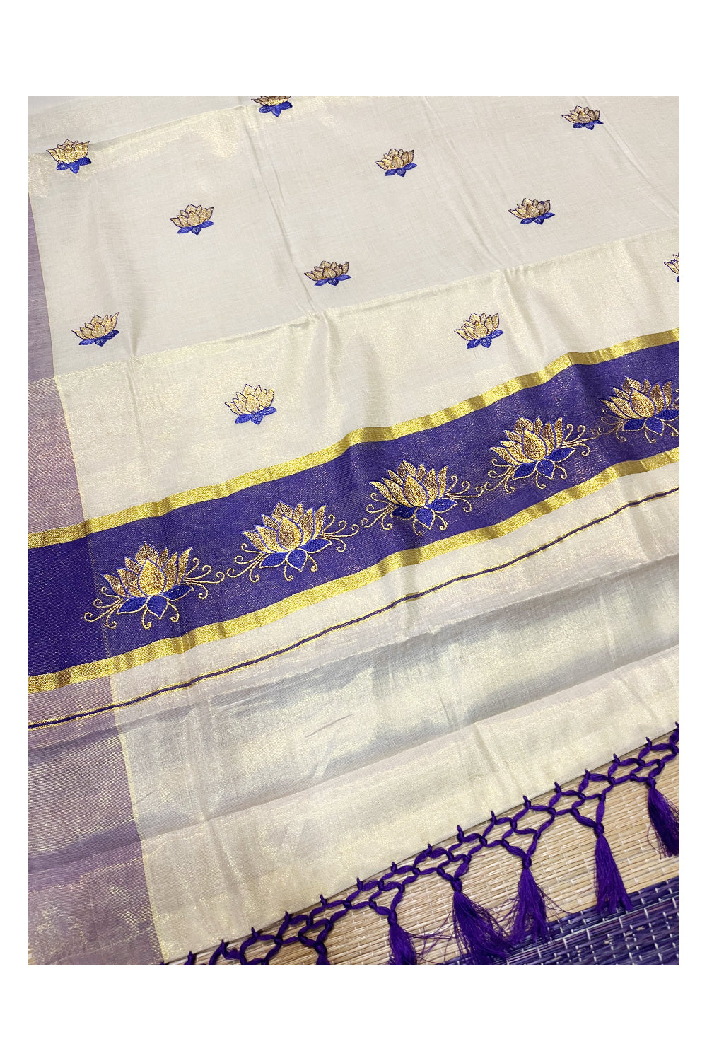 Southloom Kerala Tissue Kasavu Saree with Violet And Golden Lotus Embroidary Designs on Body