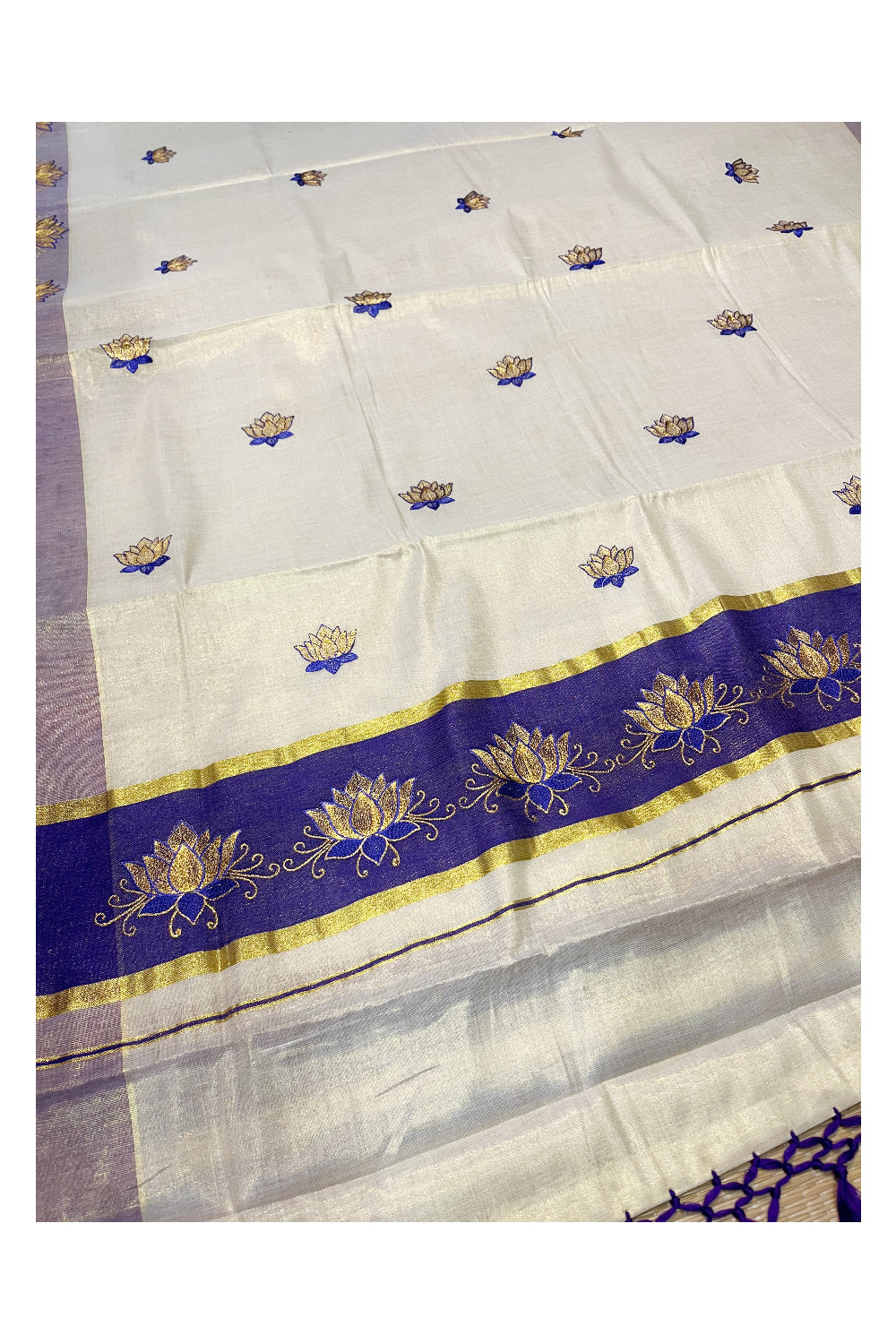 Southloom Kerala Tissue Kasavu Saree with Violet And Golden Lotus Embroidary Designs on Body