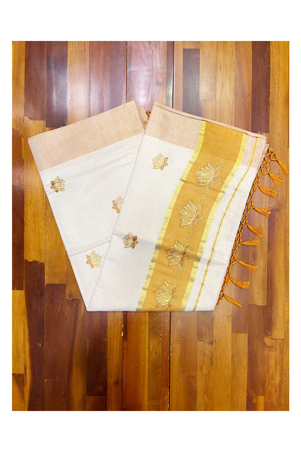 Southloom Kerala Tissue Kasavu Saree with Saffron And Golden Lotus Embroidary Designs on Body