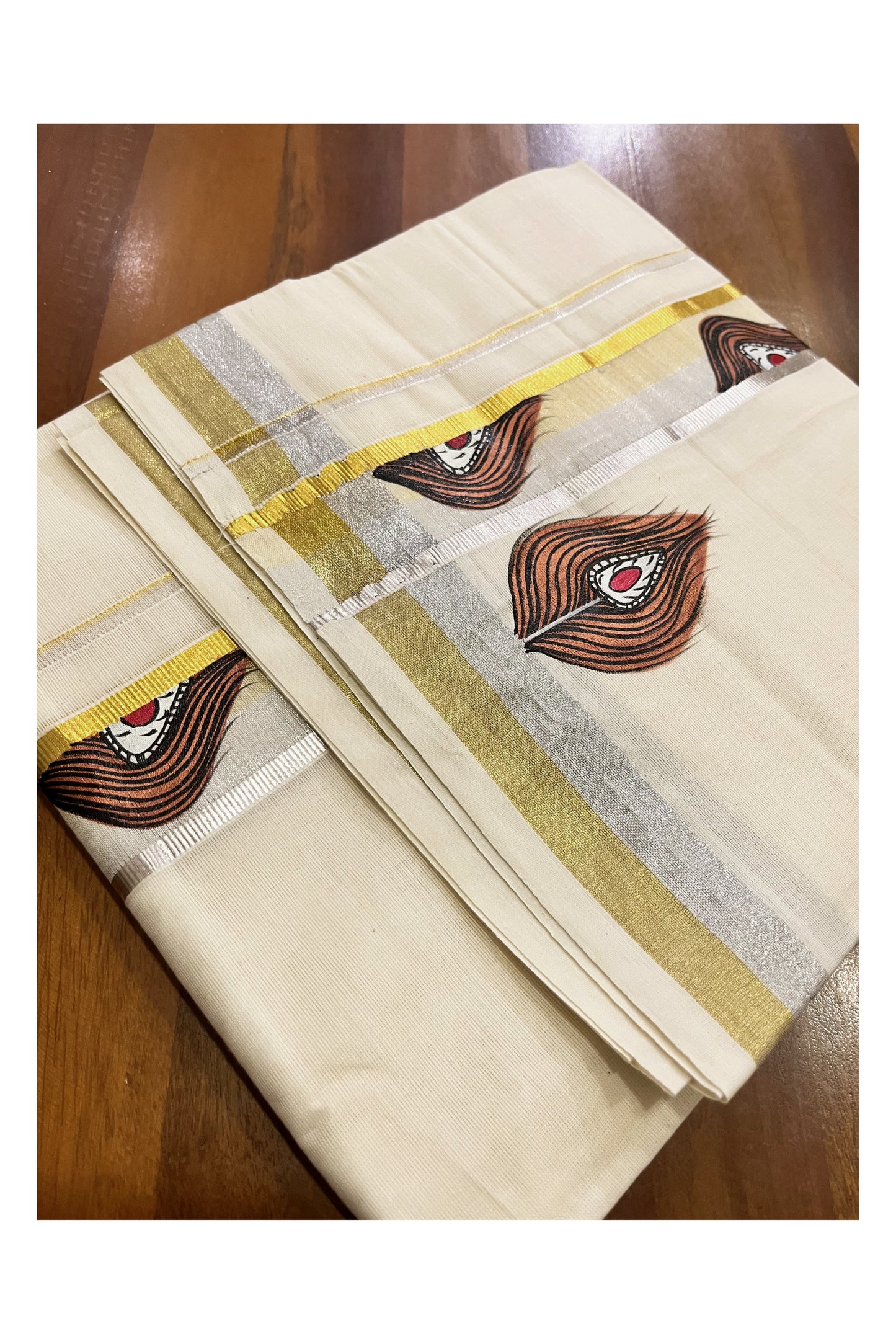 Off White Kerala Cotton Double Mundu with Feather Hand Painted Designs on Silver and Golden Kasavu Border (Vishu 2024 Collection)