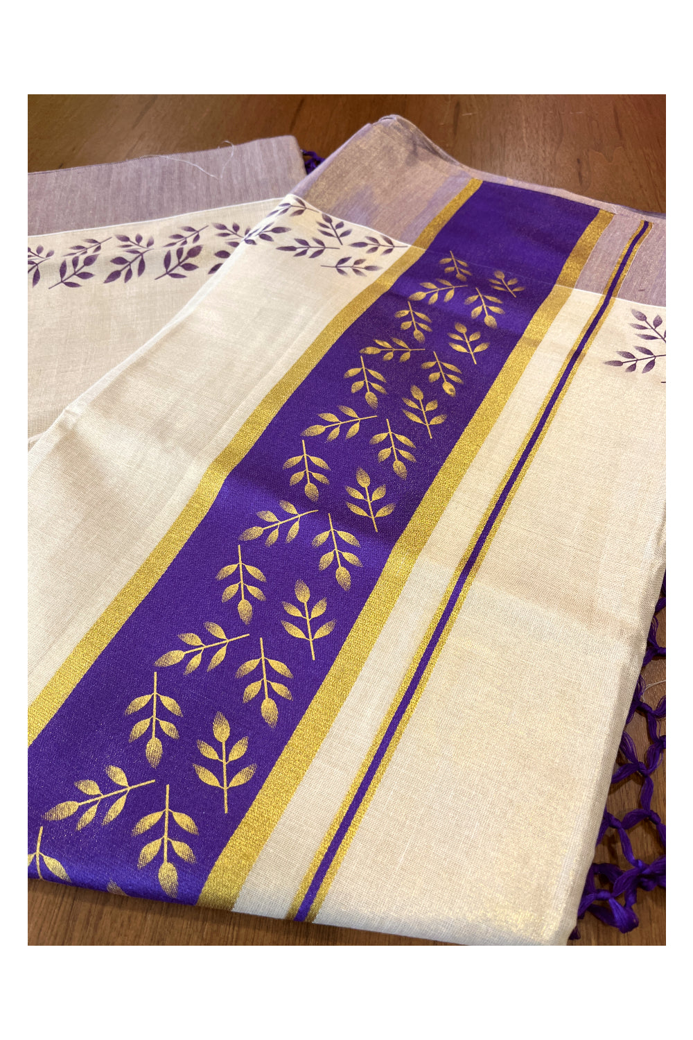 Kerala Tissue Kasavu Saree with Golden and Violet Block Prints on Border and Tassels Works