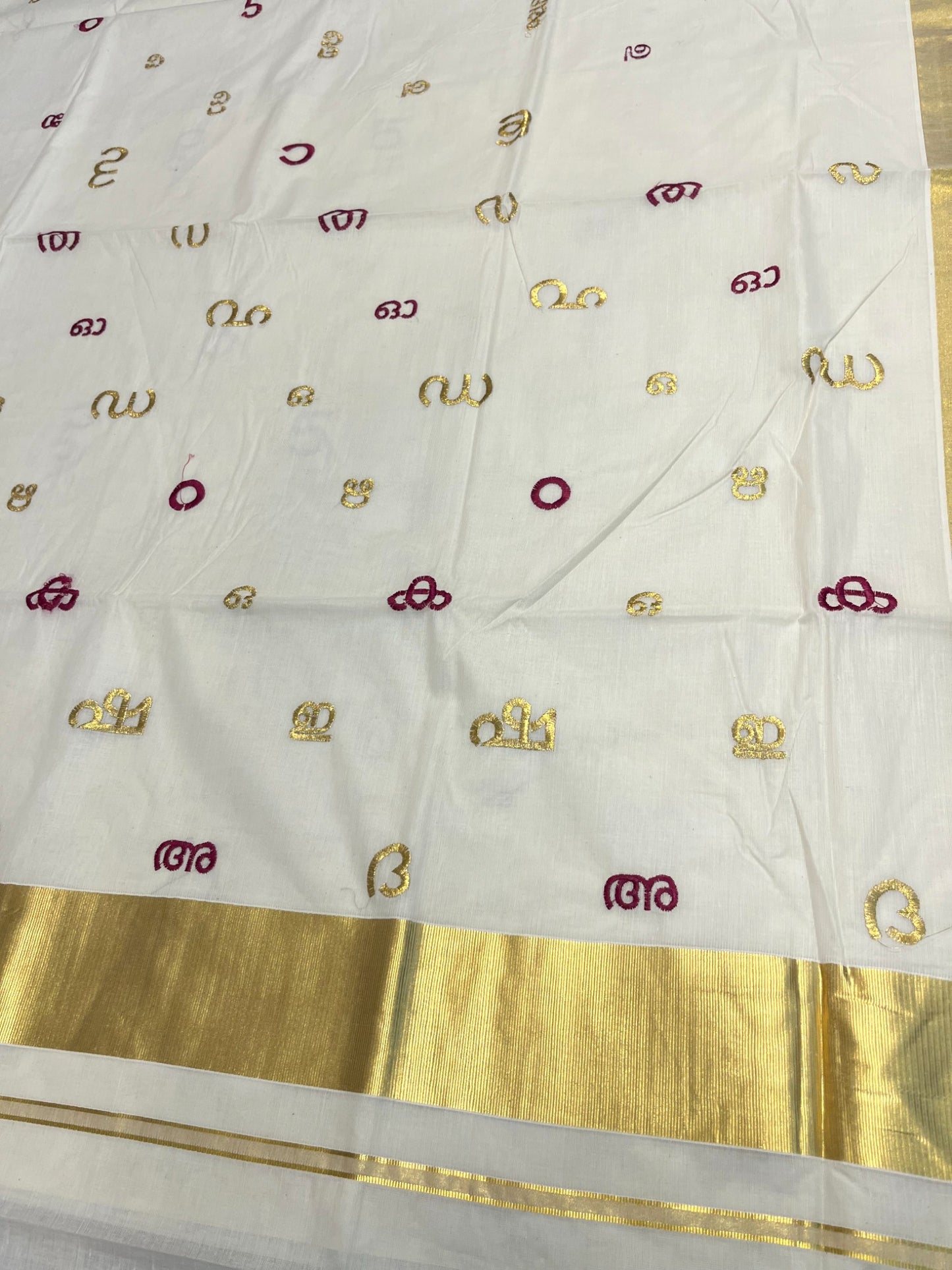 Southloom Kerala Cotton Kasavu Saree with Gold and Magenta Malayalam Aksharamala Embroidery Work on Body