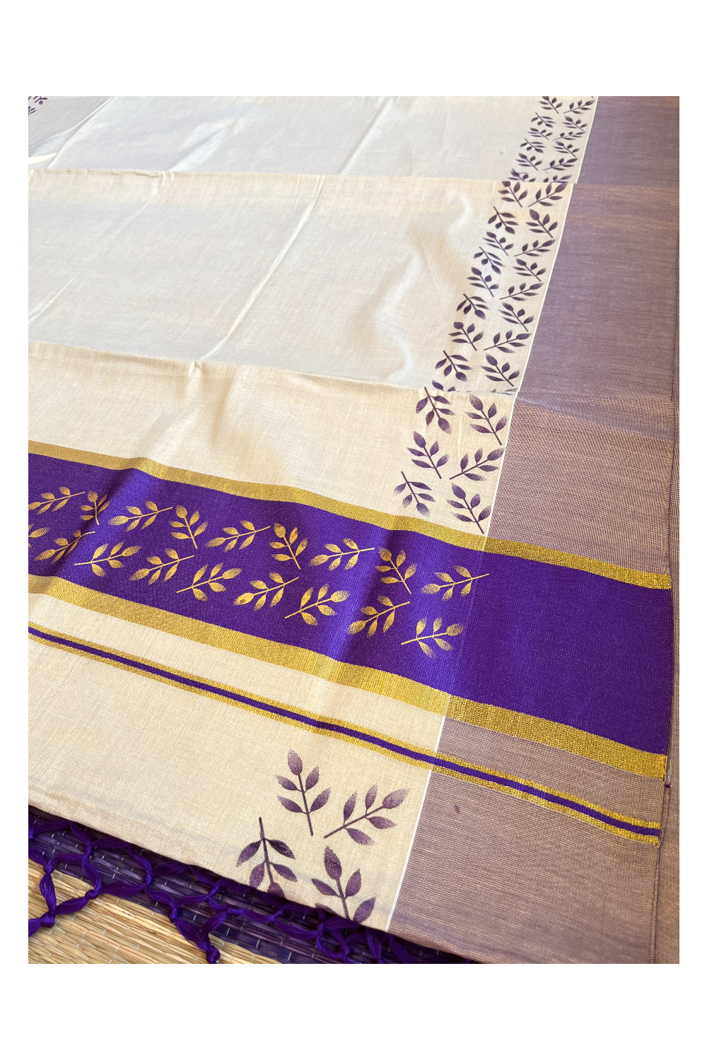 Kerala Tissue Kasavu Saree with Golden and Violet Block Prints on Border and Tassels Works