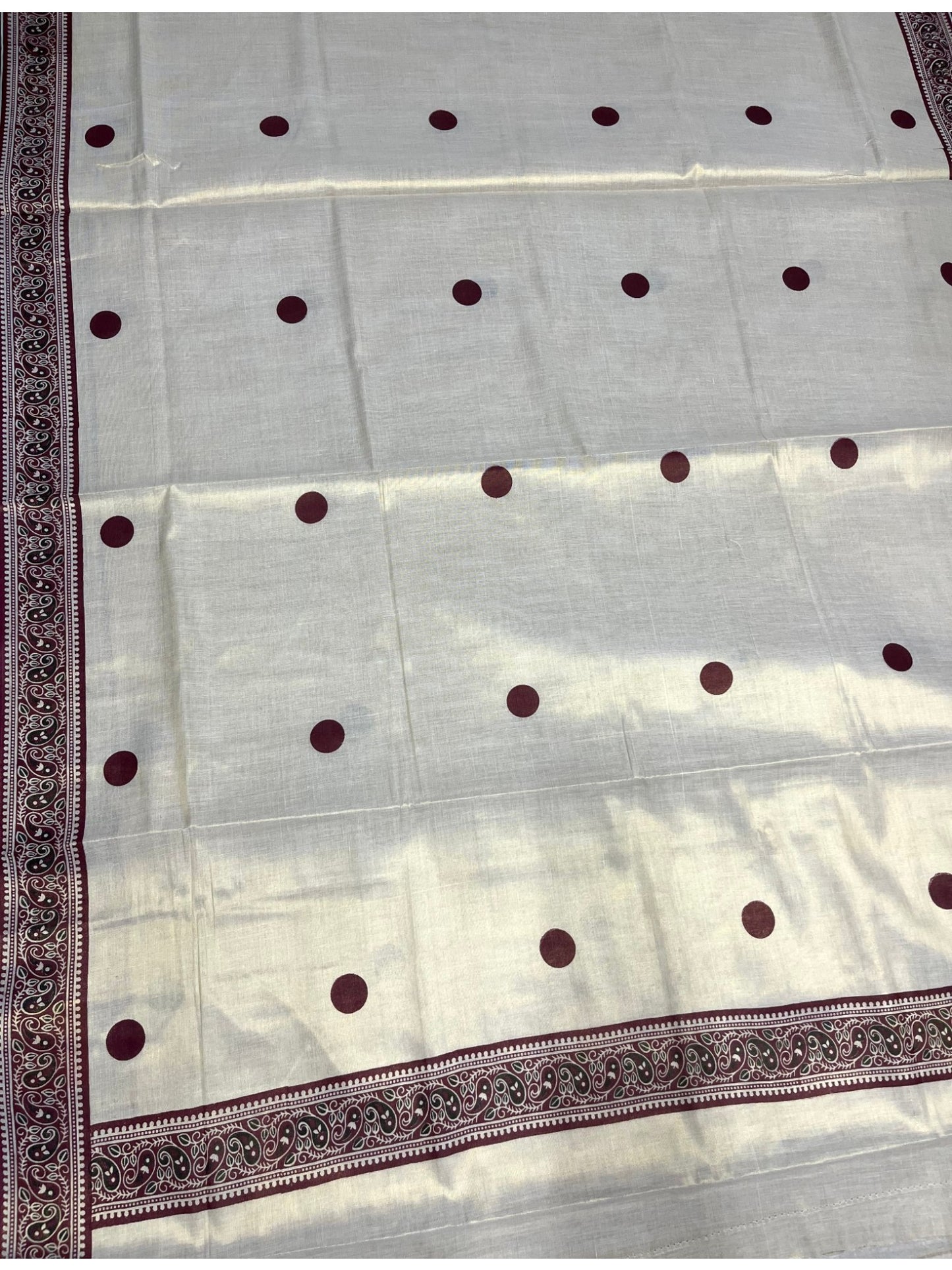 Southloom Kerala Tissue Plain Saree With Maroon Polk Dots on Body and Floral Digital Prints in Borders