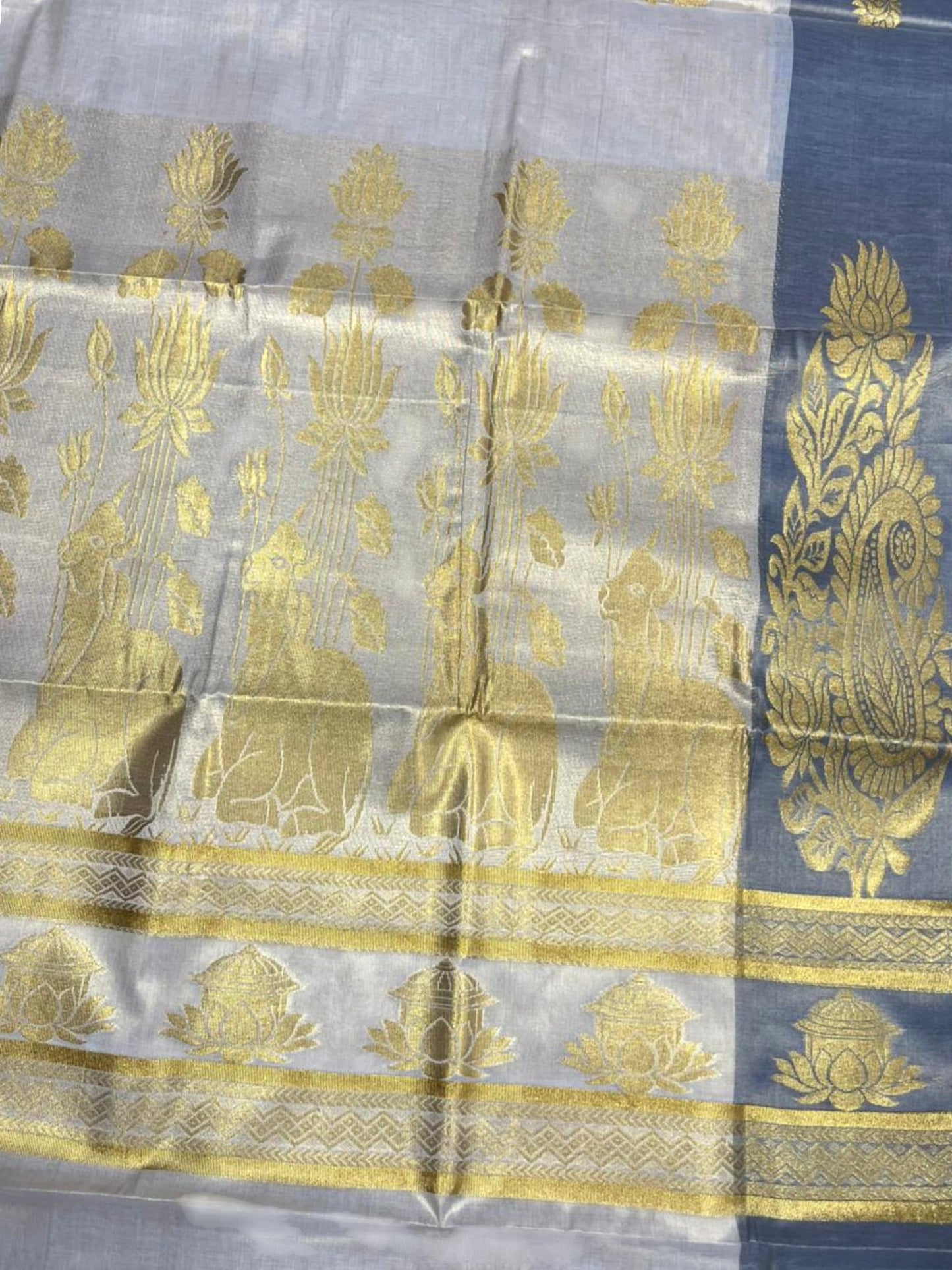Southloom  Kerala Tissue Kasavu Heavy Work Saree with Floral Design And Blue Border SL483