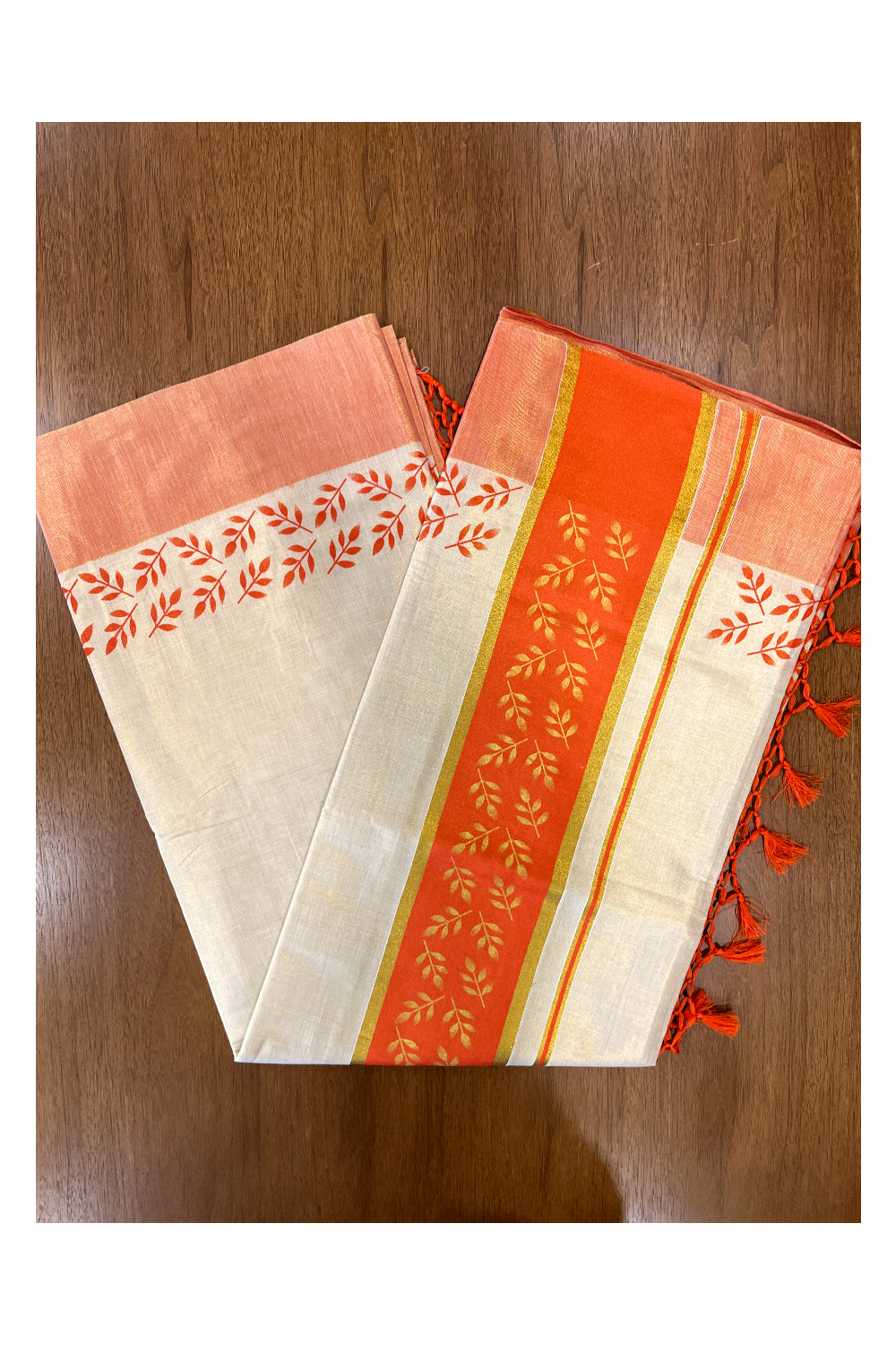 Kerala Tissue Kasavu Saree with Golden and Orange Block Prints on Border and Tassels Works