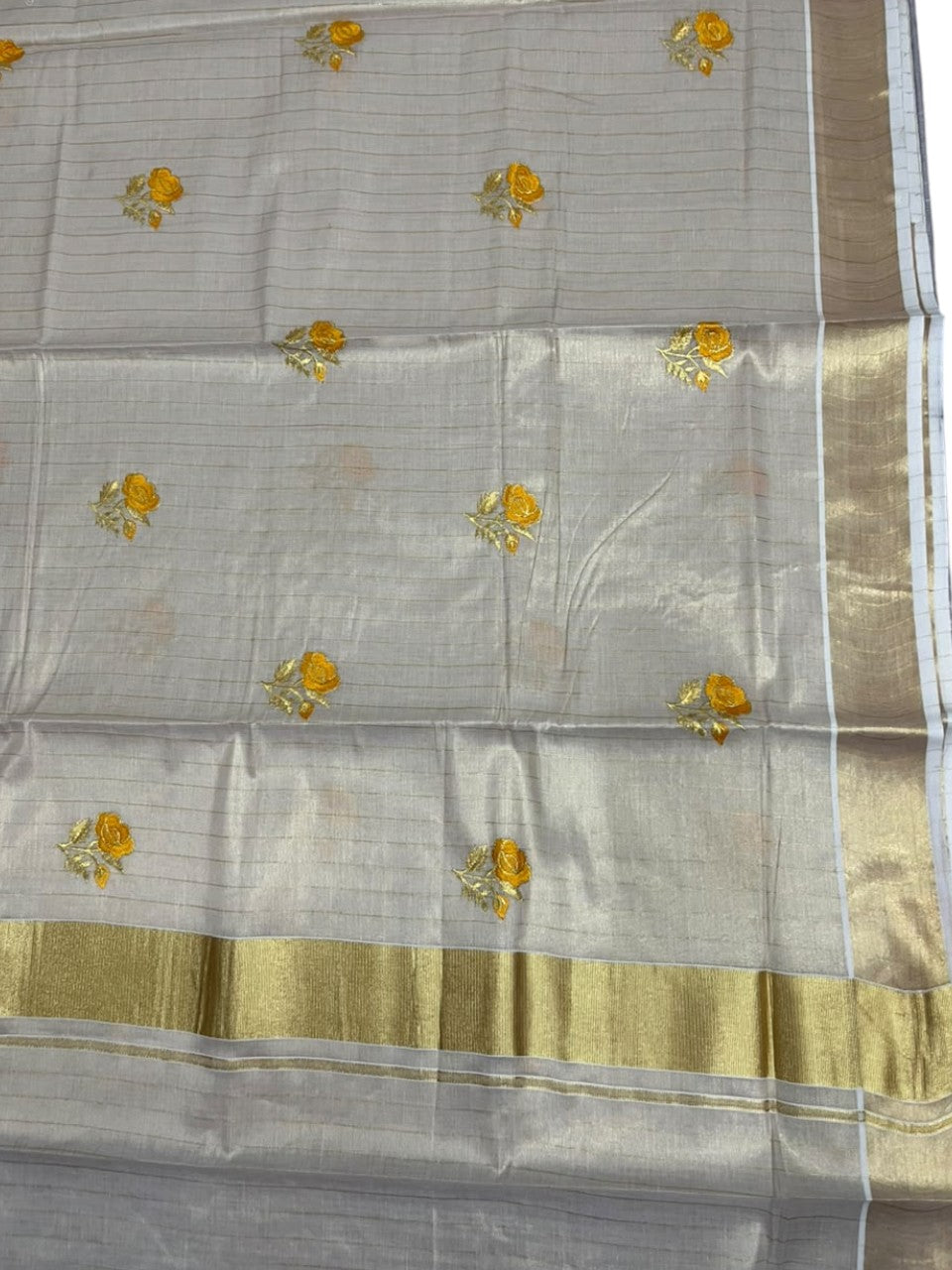 Southloom Tissue Kerala Kasavu Saree with Floral Embroidery Design On Border