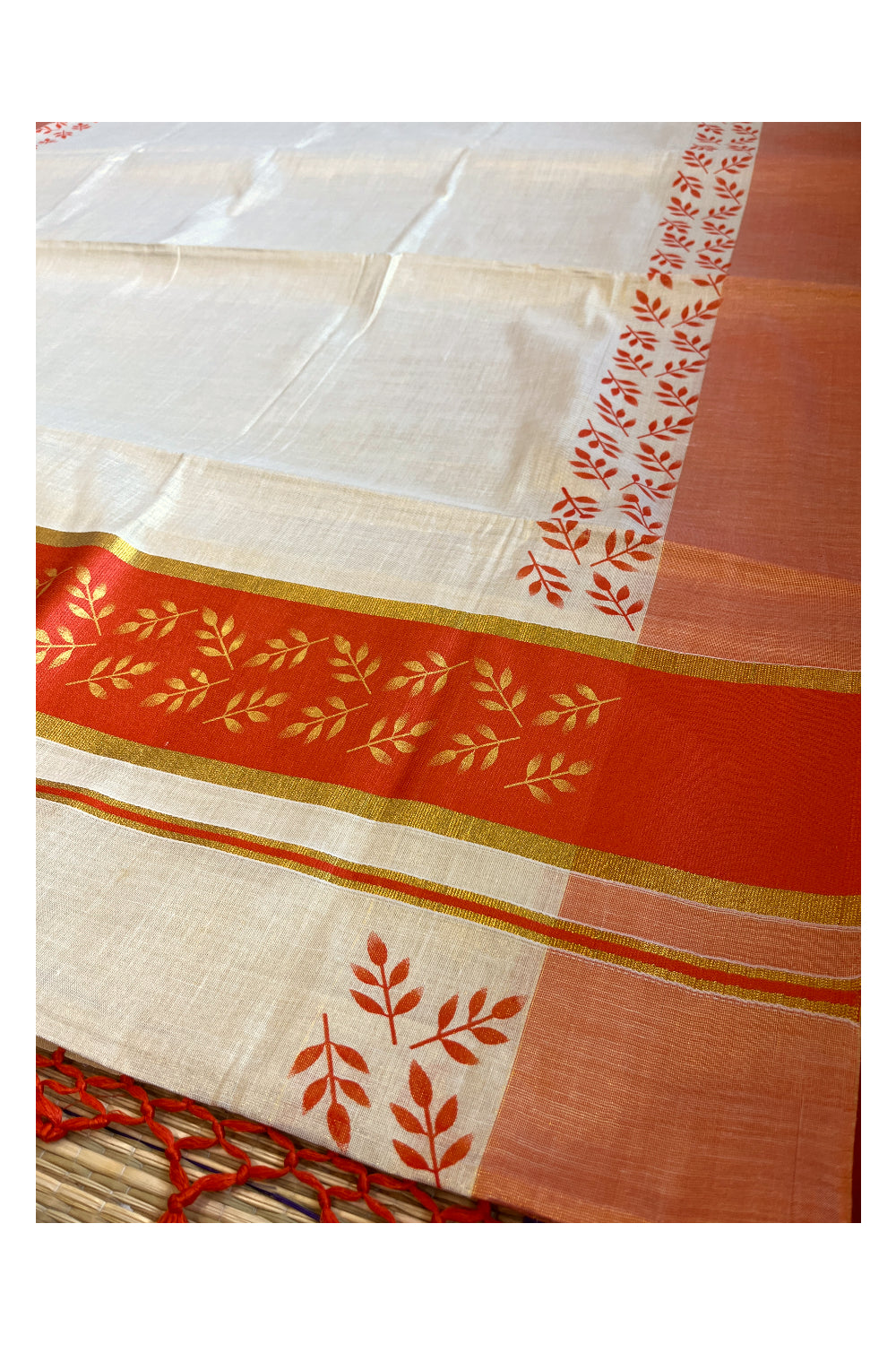 Kerala Tissue Kasavu Saree with Golden and Orange Block Prints on Border and Tassels Works