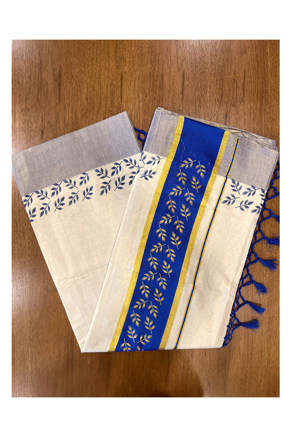 Kerala Tissue Kasavu Saree with Golden and Blue Block Prints on Border and Tassels Works