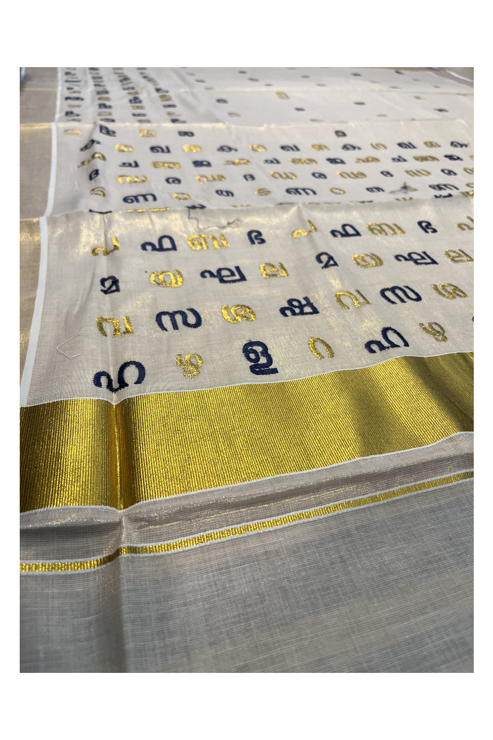 Southloom Kerala Tissue Kasavu Saree with Blue and Gold Malayalam Aksharamala Embroidery Work on Body