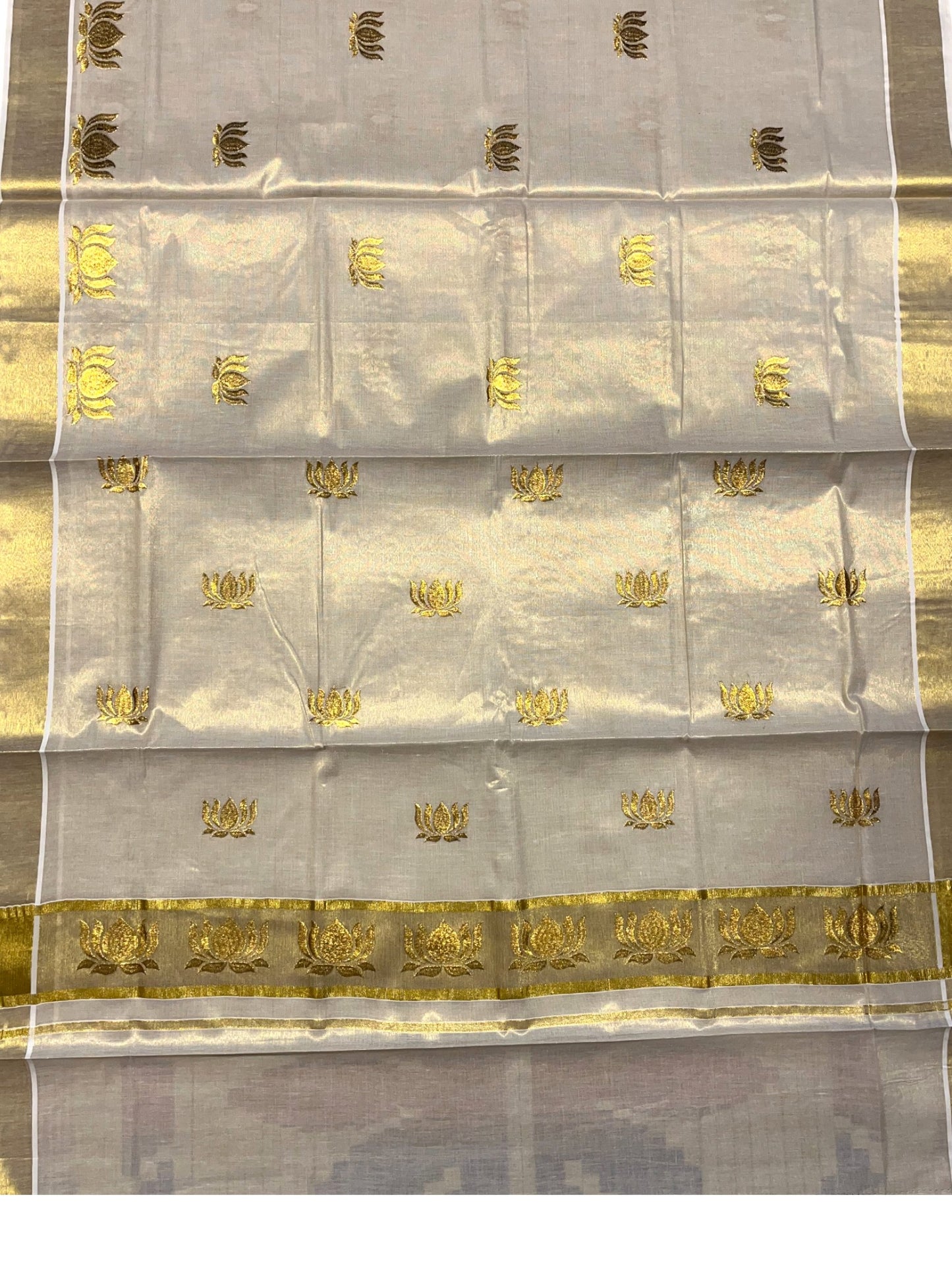 Southloom Tissue Kerala Kasavu Saree with Lotus Embroidery Design