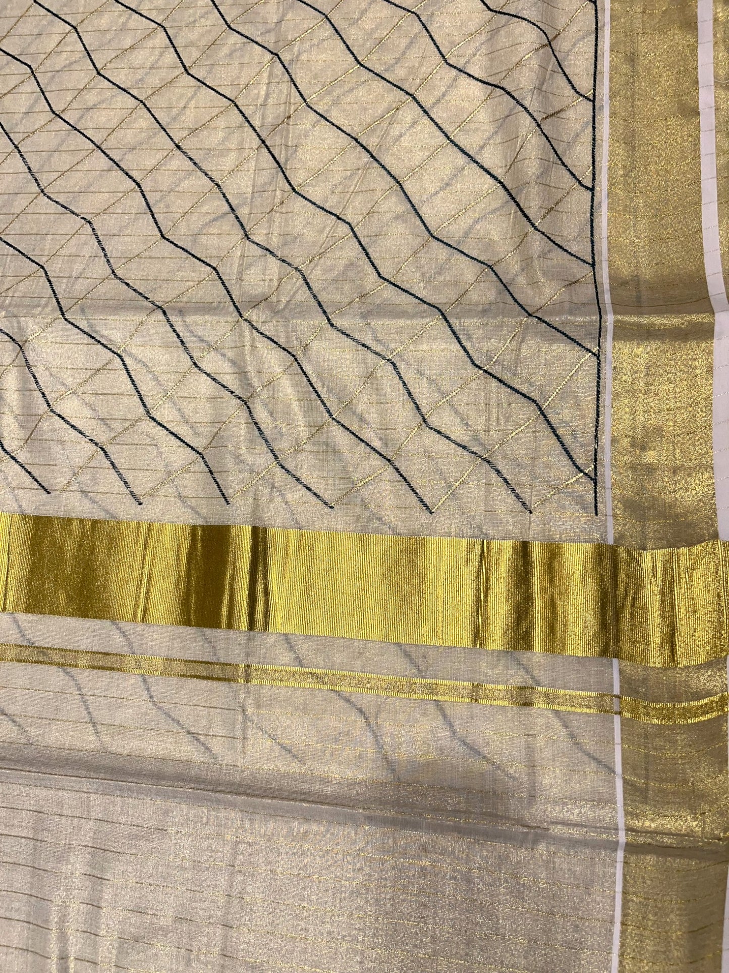 Kerala Tissue Kasavu Stripes Saree with Green and Gold Embroidery Design on Body
