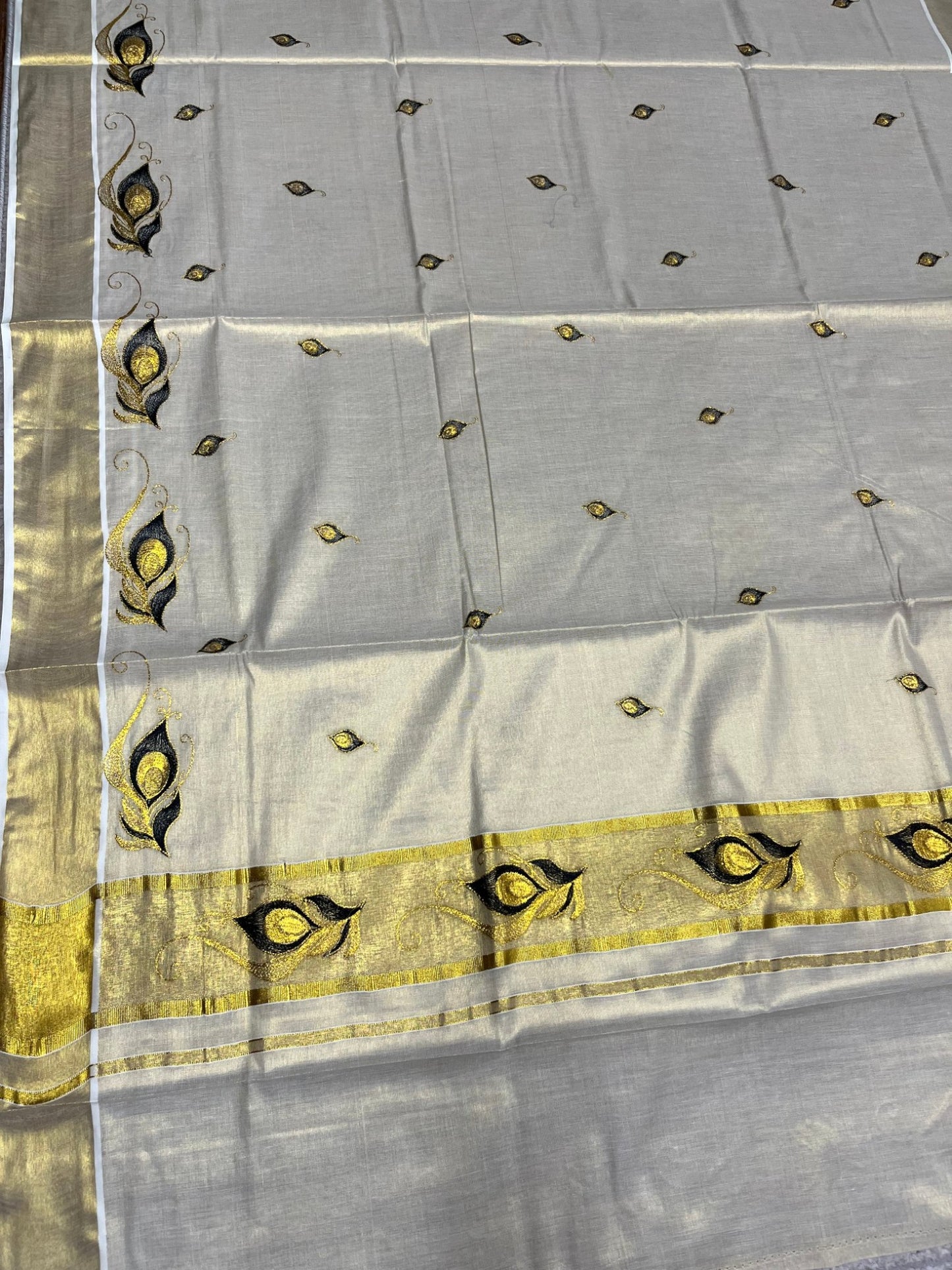 Southloom Kerala Tissue Kasavu Saree with Black Peacock Feather Embroidery Works