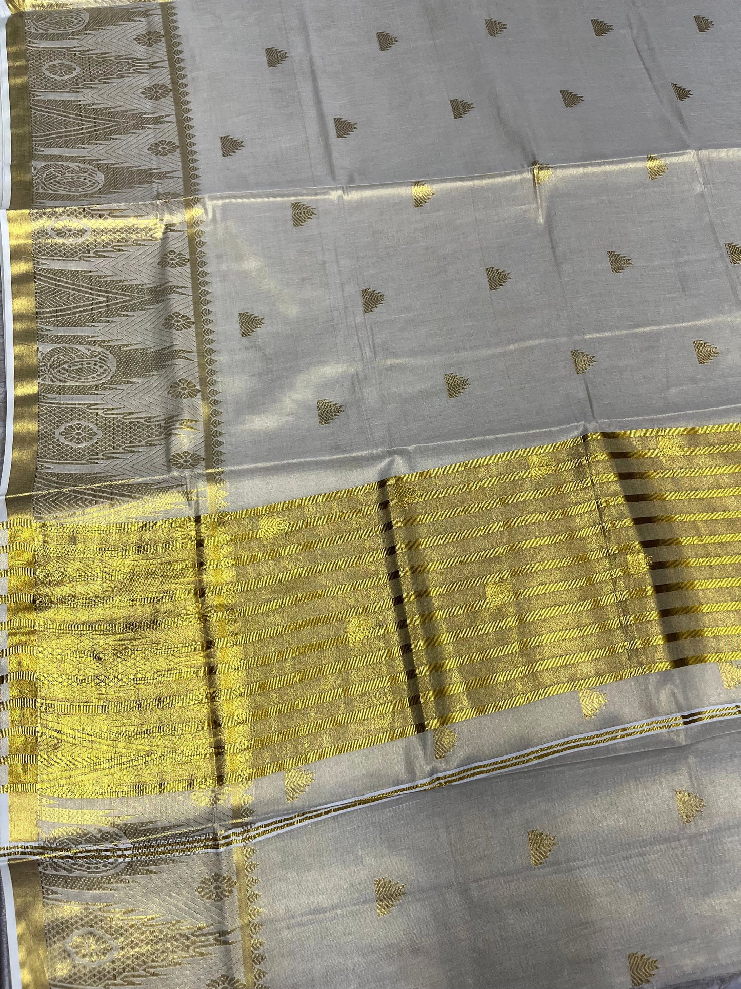 Southloom Tissue Kerala Kasavu Saree with Tample Woven Work on Body and Temple Border with Peacock Design