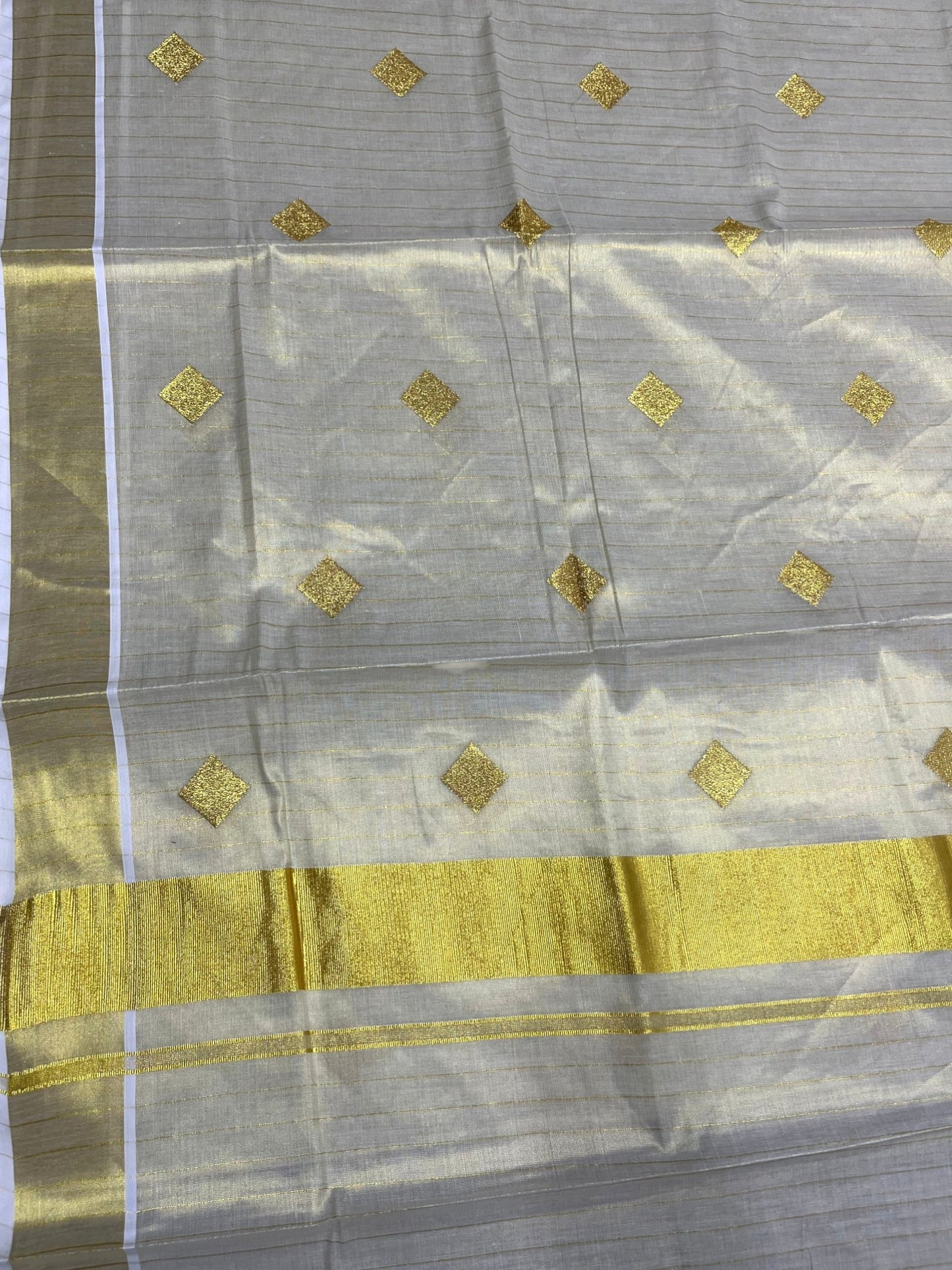 Southloom Kerala Tissue Kasavu Striped Saree with  Diagonal Woven Designs in Golden Body Work