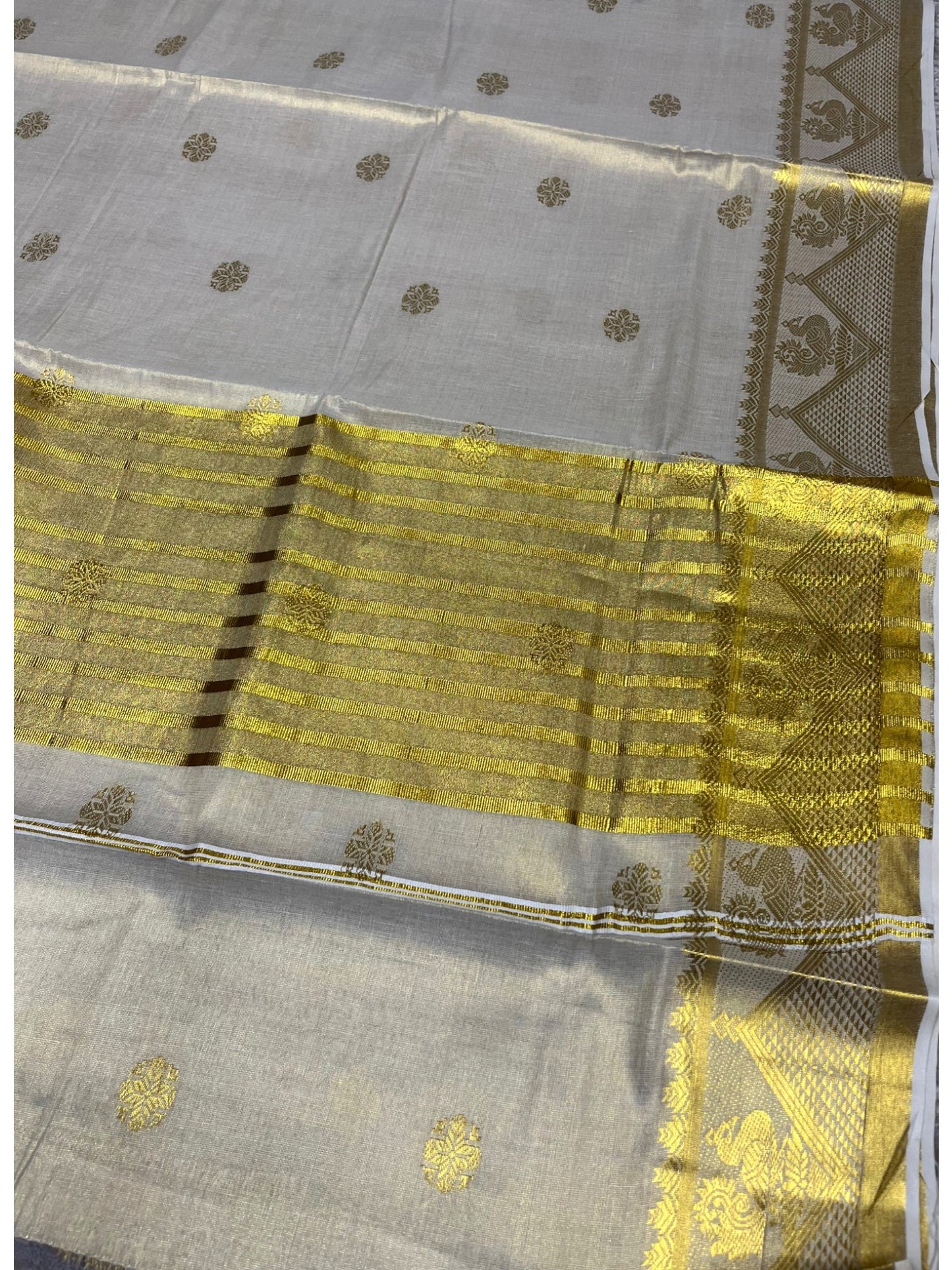Southloom Tissue Kerala Kasavu Saree with Floral Woven Work on Body and Temple Border with Peacock Design