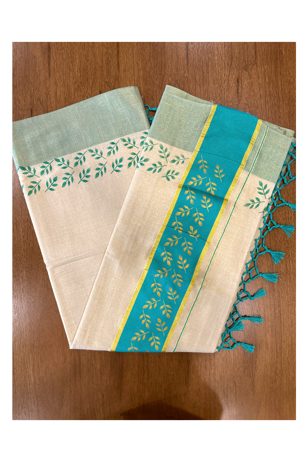 Kerala Tissue Kasavu Saree with Golden and Turquoise Block Prints on Border and Tassels Works