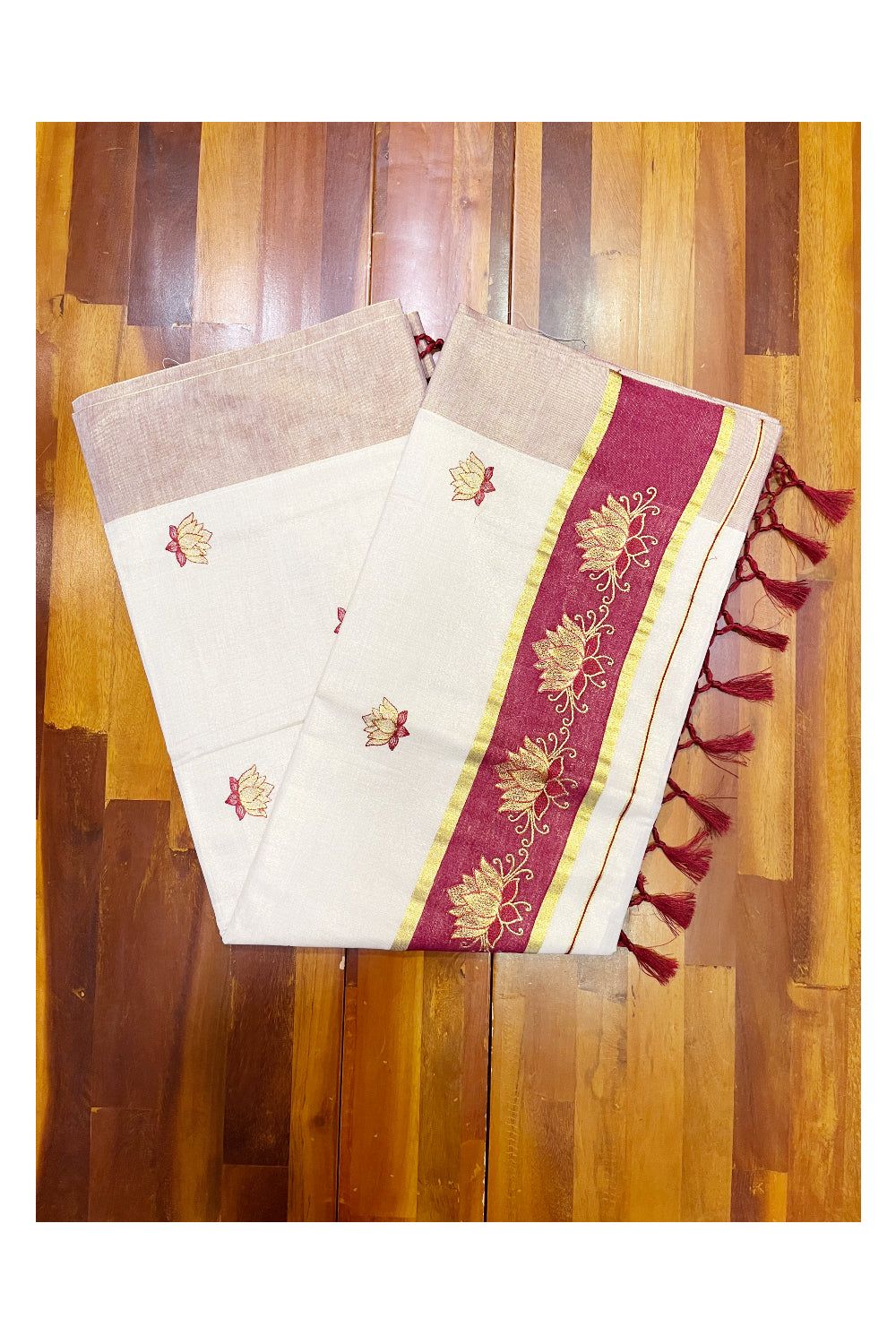 Southloom Kerala Tissue Kasavu Saree with Maroon And Golden Lotus Embroidary Designs on Body