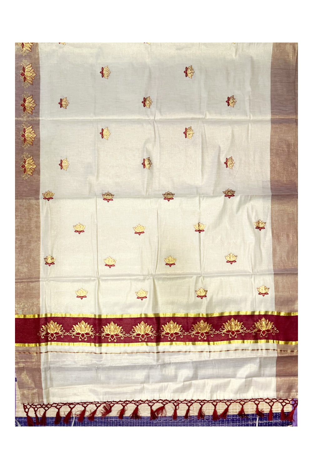 Southloom Kerala Tissue Kasavu Saree with Maroon And Golden Lotus Embroidary Designs on Body
