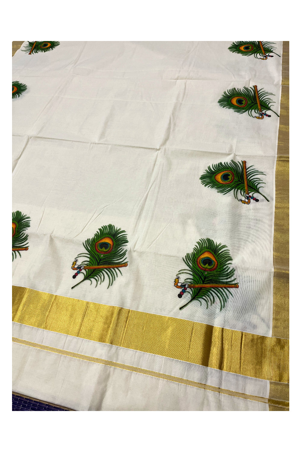 Pure Cotton Kerala Kasavu Saree with Feather and Flute Mural Prints on Border