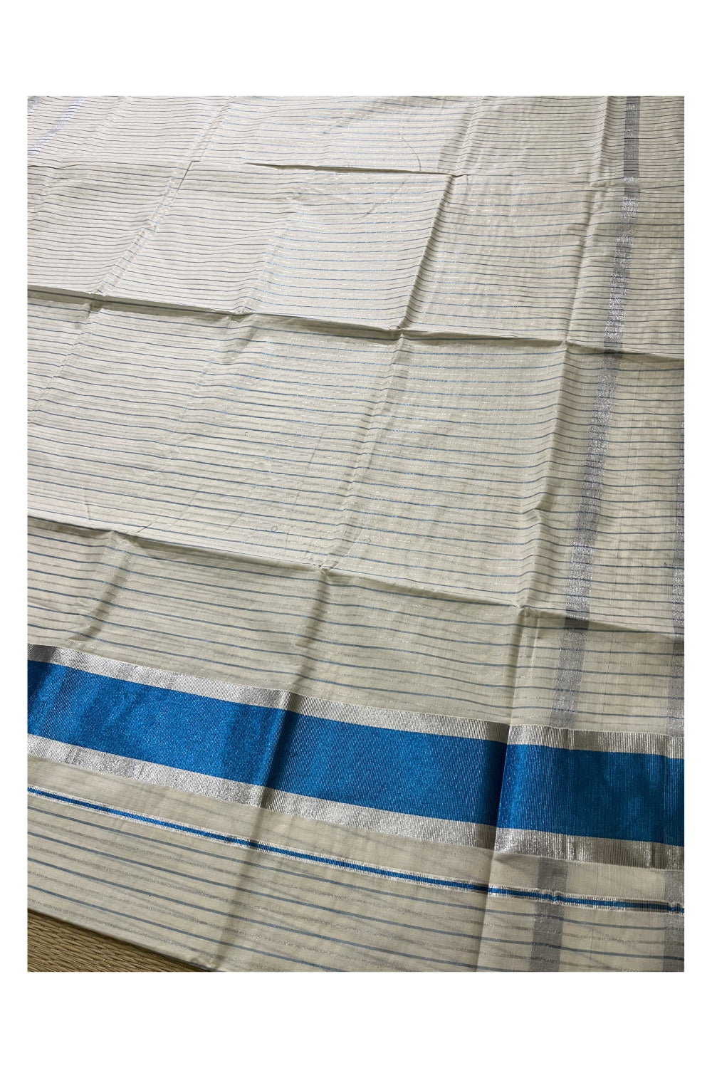 Pure Cotton Kerala Saree with Silver and Blue Kasavu Lines Across Body