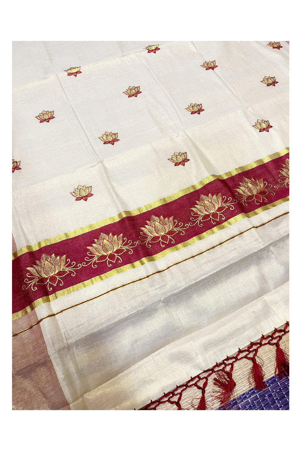 Southloom Kerala Tissue Kasavu Saree with Maroon And Golden Lotus Embroidary Designs on Body