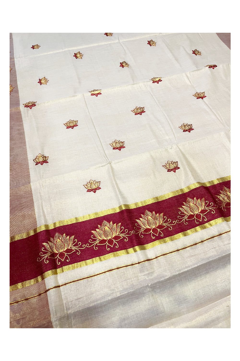 Southloom Kerala Tissue Kasavu Saree with Maroon And Golden Lotus Embroidary Designs on Body