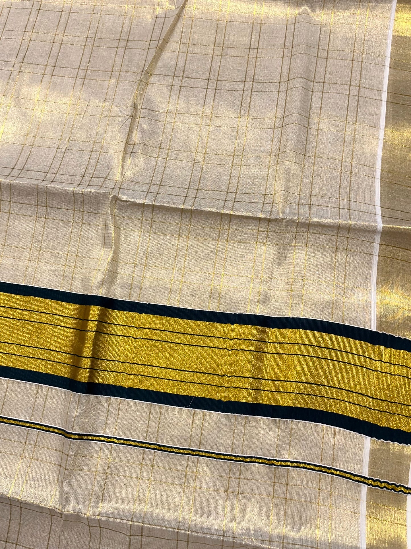Southloom Tissue Check Kerala Kasavu Saree with Lotus Design And Green Border