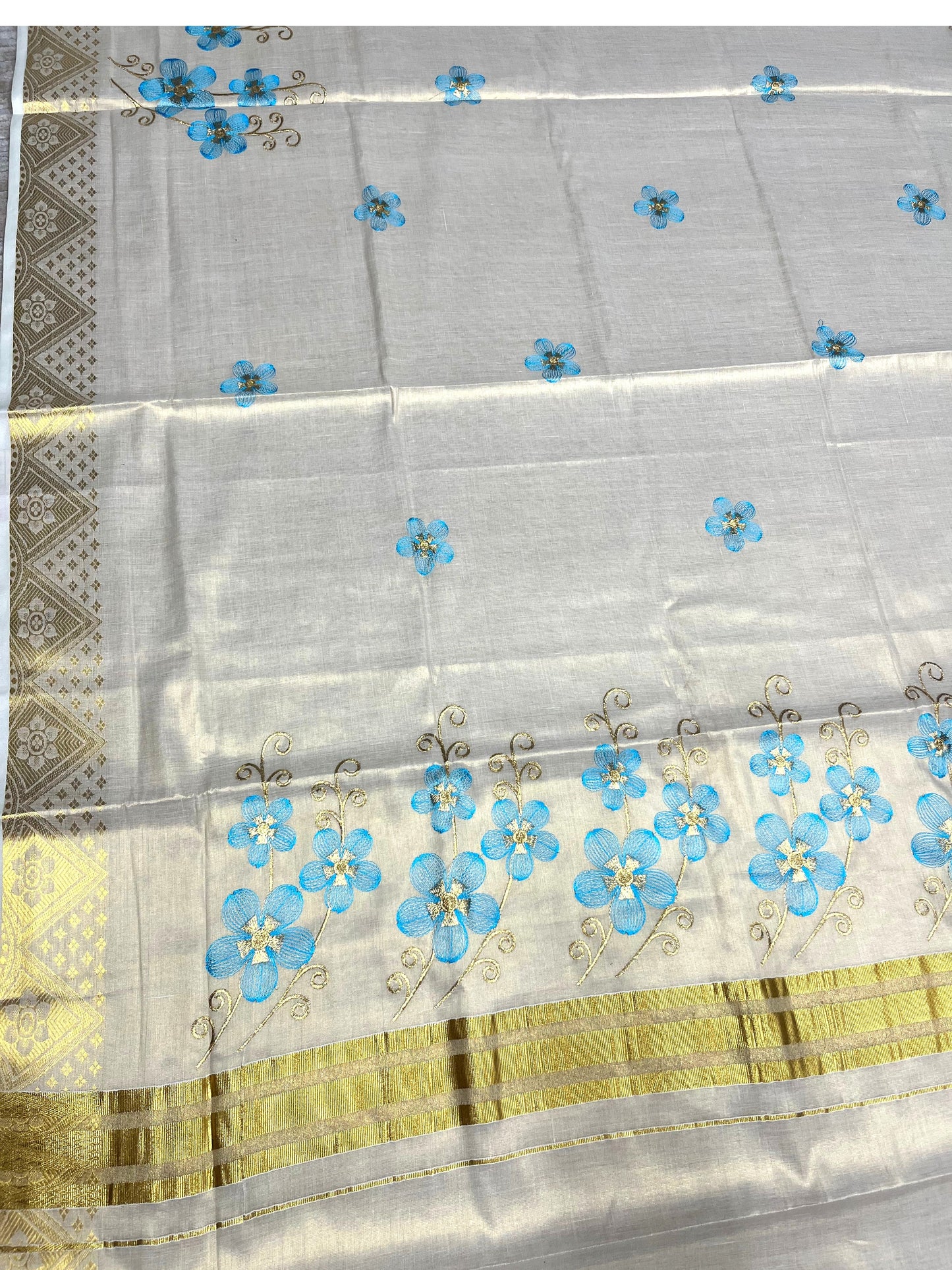 Southloom Kerala Tissue Kasavu Saree with Blue Floral Embroidery Work on Body
